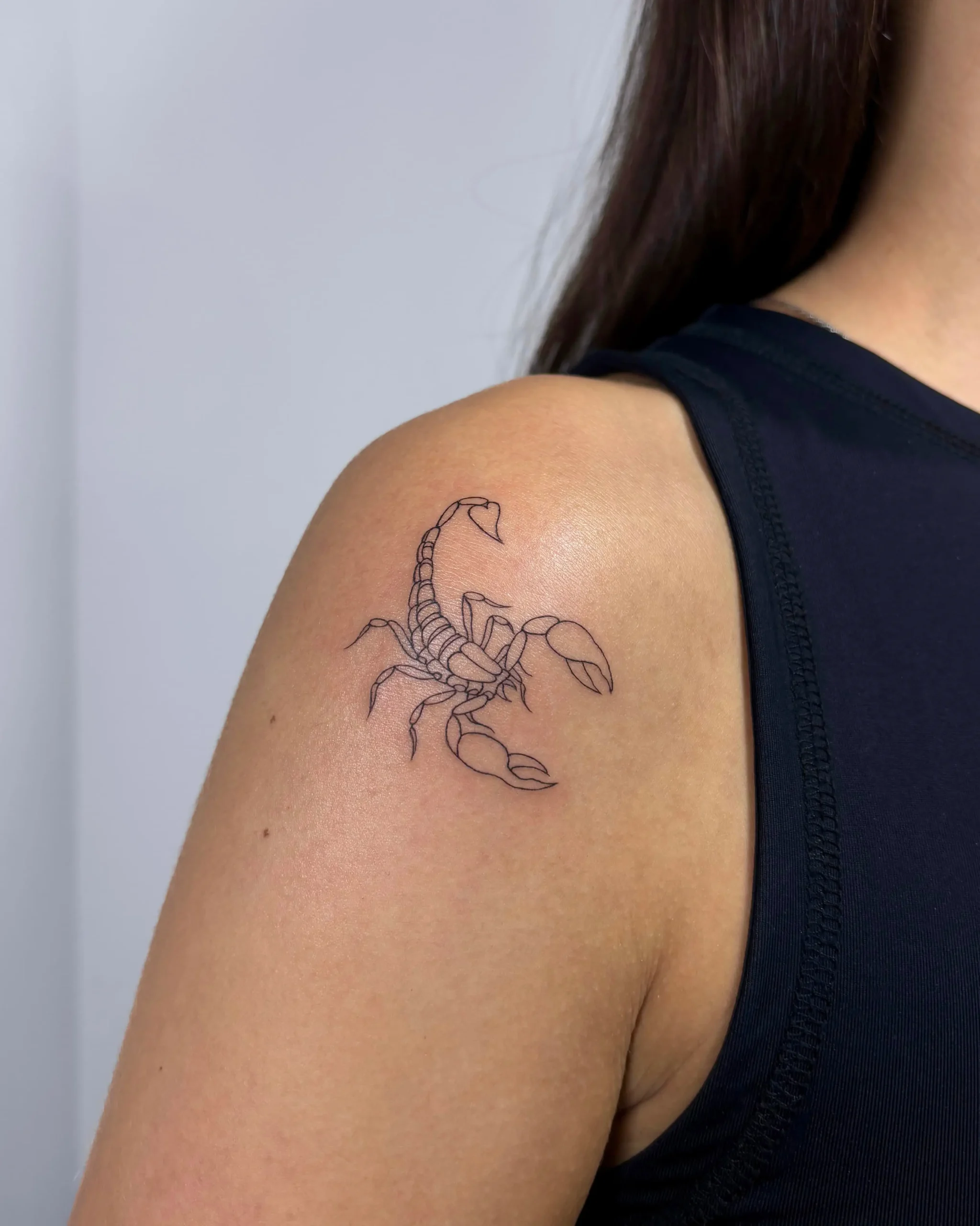Minimalist fine line scorpion tattoo on woman's shoulder - Walk In Tattoo Budapest Minimalist fine line scorpion tattoo on woman's shoulder - Walk In Tattoo Budapest