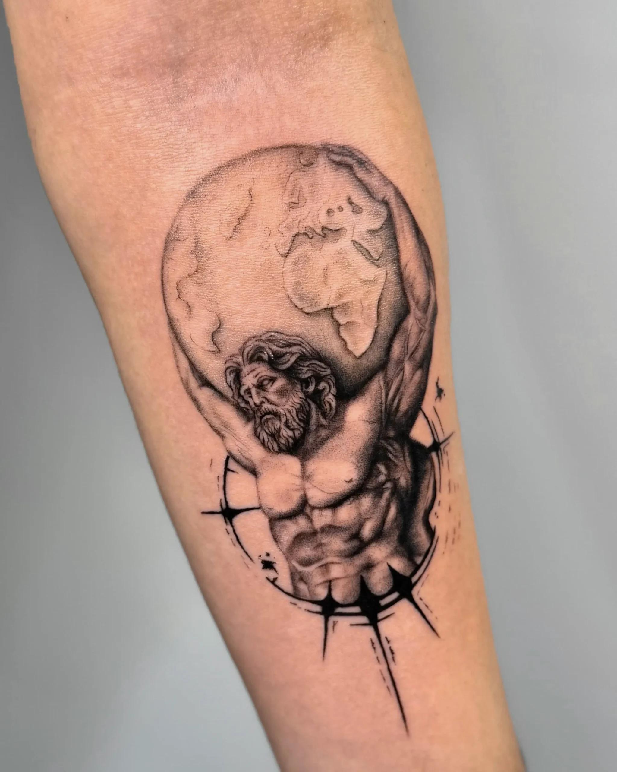Greek mythology Atlas tattoo holding the world on his shoulders - Walk In Tattoo Budapest