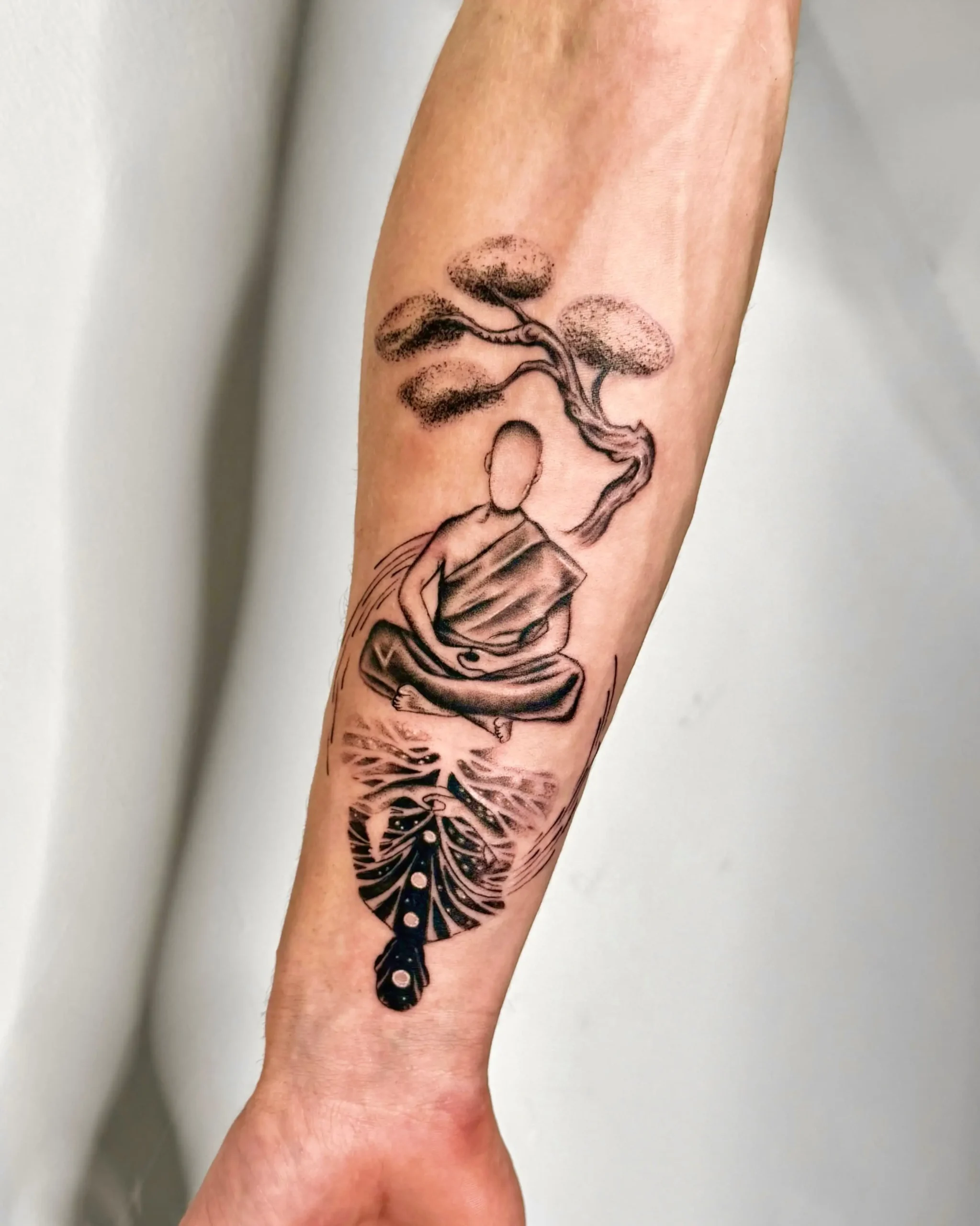 Spiritual zen tattoo of a monk meditating under a bonsai tree with water reflection - Walk In Tattoo Budapest Spiritual zen tattoo of a monk meditating under a bonsai tree with water reflection - Walk In Tattoo Budapest