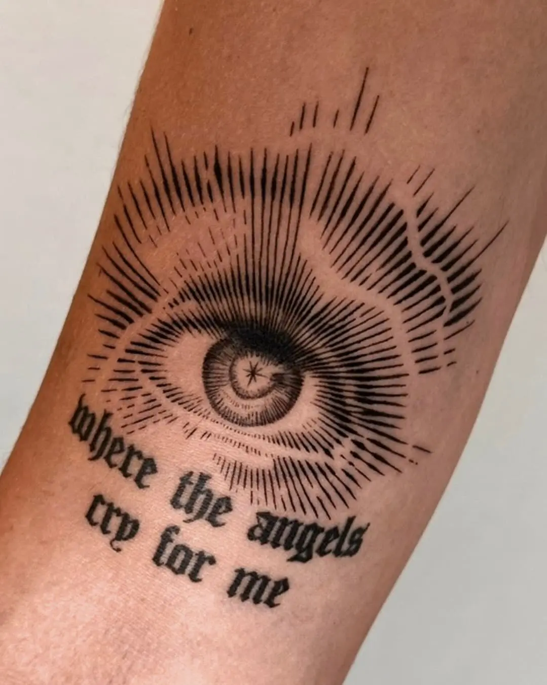 Realistic all-seeing eye tattoo with gothic lettering "where the angels cry for me" - Walk In Tattoo Budapest