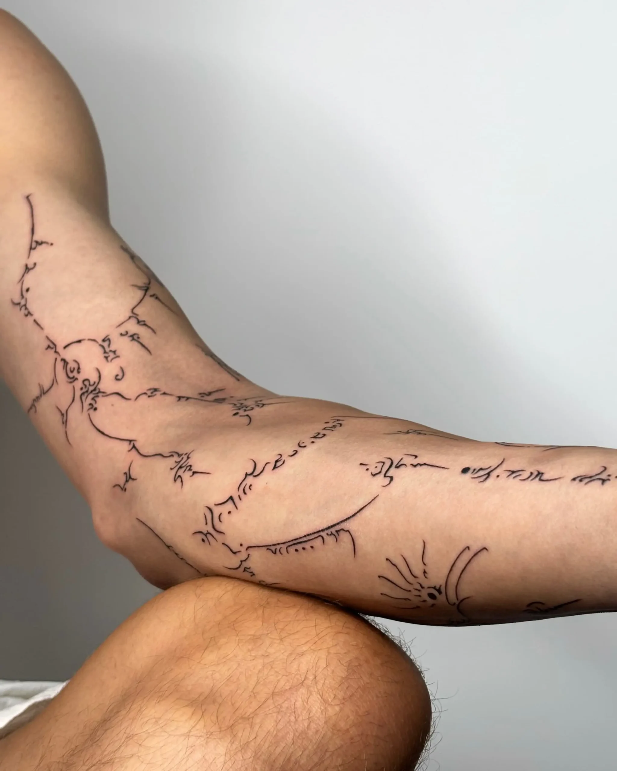 Abstract cyber-sigilism fine line tattoo on arm and elbow - Walk In Tattoo Budapest