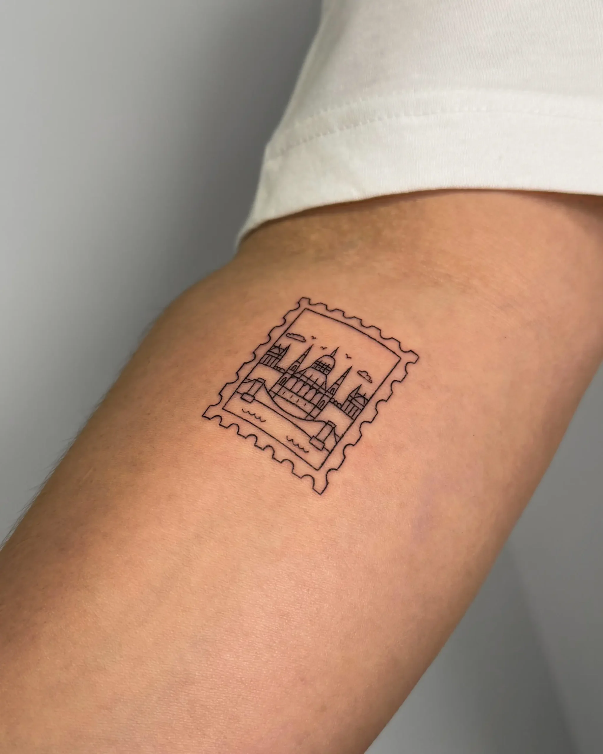 Minimalist postage stamp tattoo of the Hungarian Parliament Building in Budapest